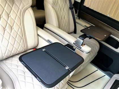 Single Side Folding Table Mounted On The Armrest Of A Single Seat in A Van